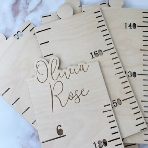 Personalized wooden growth chart ruler engraved with child’s name