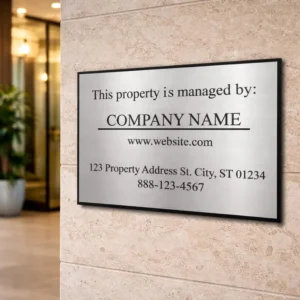 Close-up of engraved “Property Managed By” text on custom property management sign