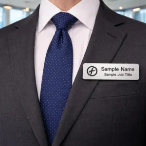 Close-up of custom magnetic name tag showing engraved name and logo